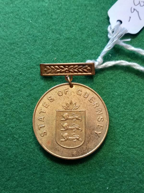 A  LIBERATION OF GUERNSEY MEDAL / RARE ITEM.